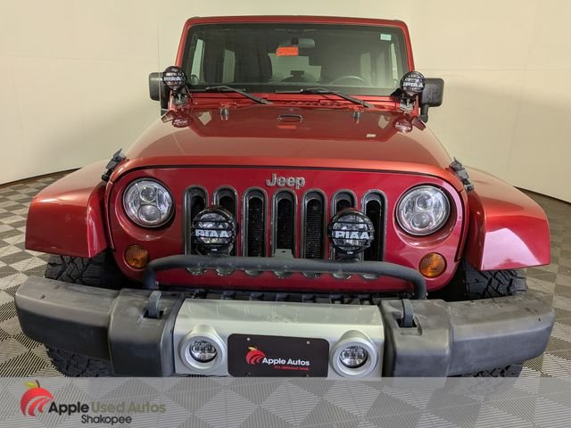 Used 2011 Jeep Wrangler Unlimited Sahara with VIN 1J4BA5H1XBL588601 for sale in Shakopee, Minnesota