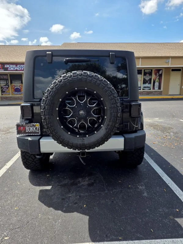 Used 2014 Black Jeep Unlimited Sahara image 4