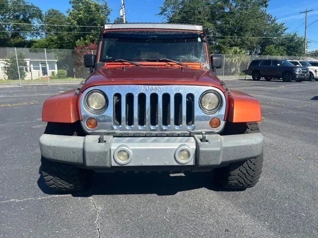 Used 2009 Orange Jeep Unlimited Sahara image 7