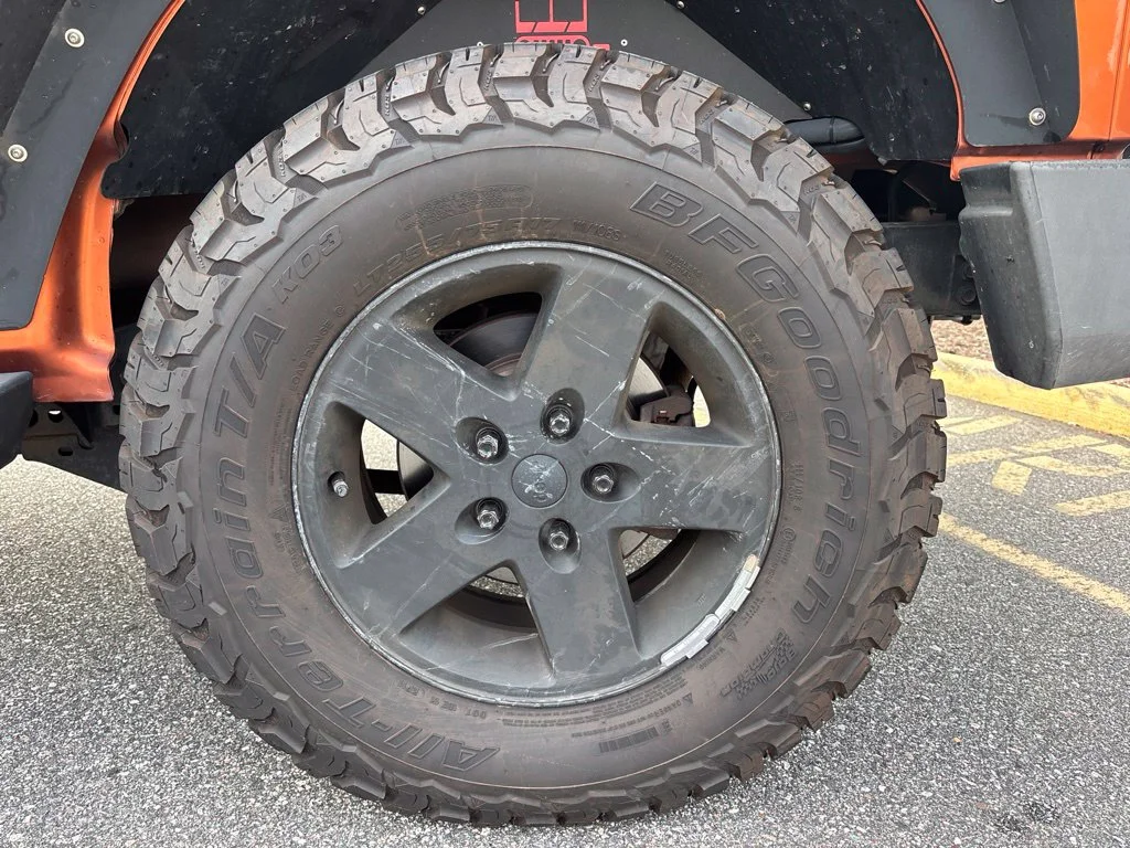 Used 2010 Orange Jeep Unlimited Sport image 16