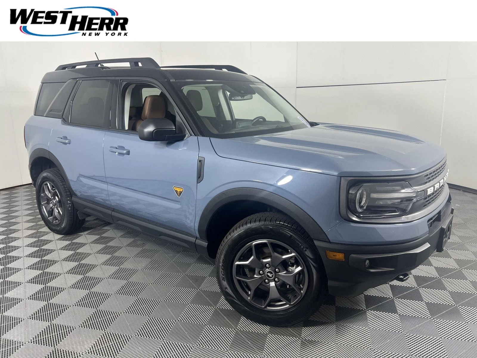 Used 2024 Azure Gray Metallic Tri-Coat Ford Badlands image 1