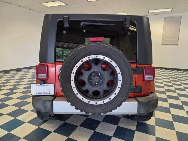 Used 2009 Orange Jeep Unlimited Sahara image 6