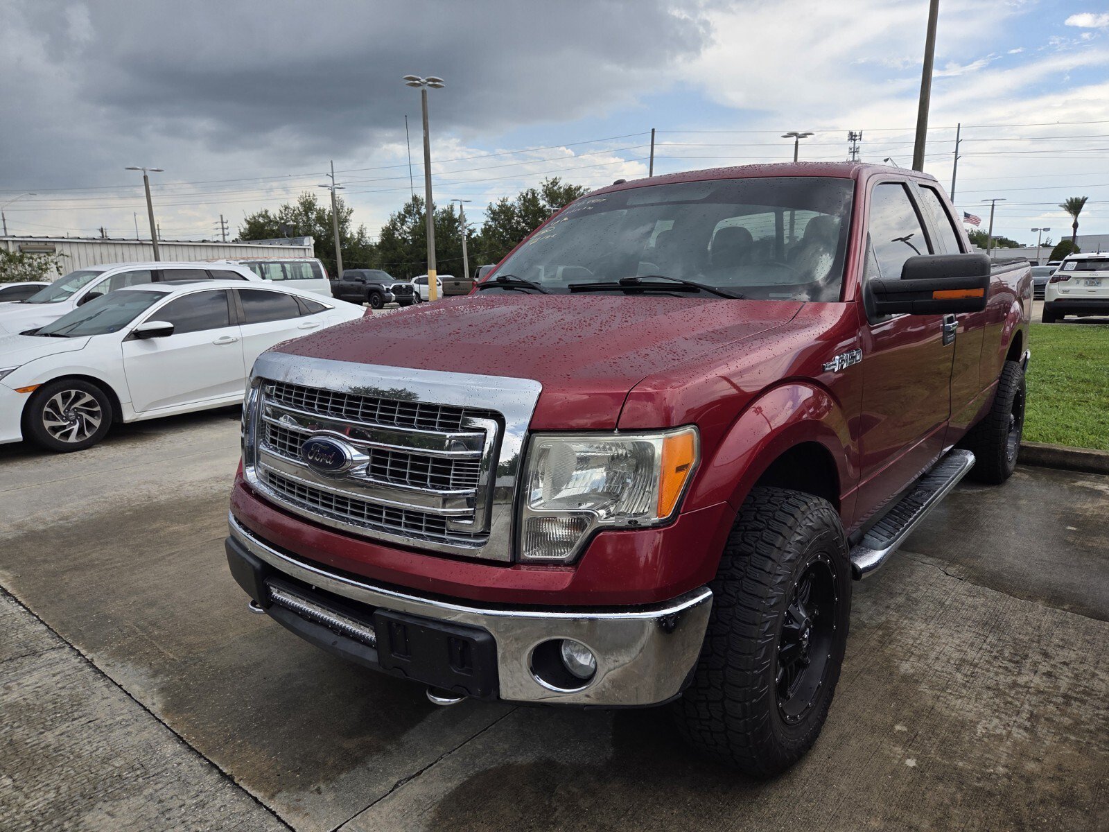 Used 2013 Ruby Red Metallic Ford XLT image 2