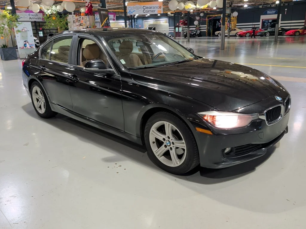Used 2014 Black BMW 320i xDrive image 1