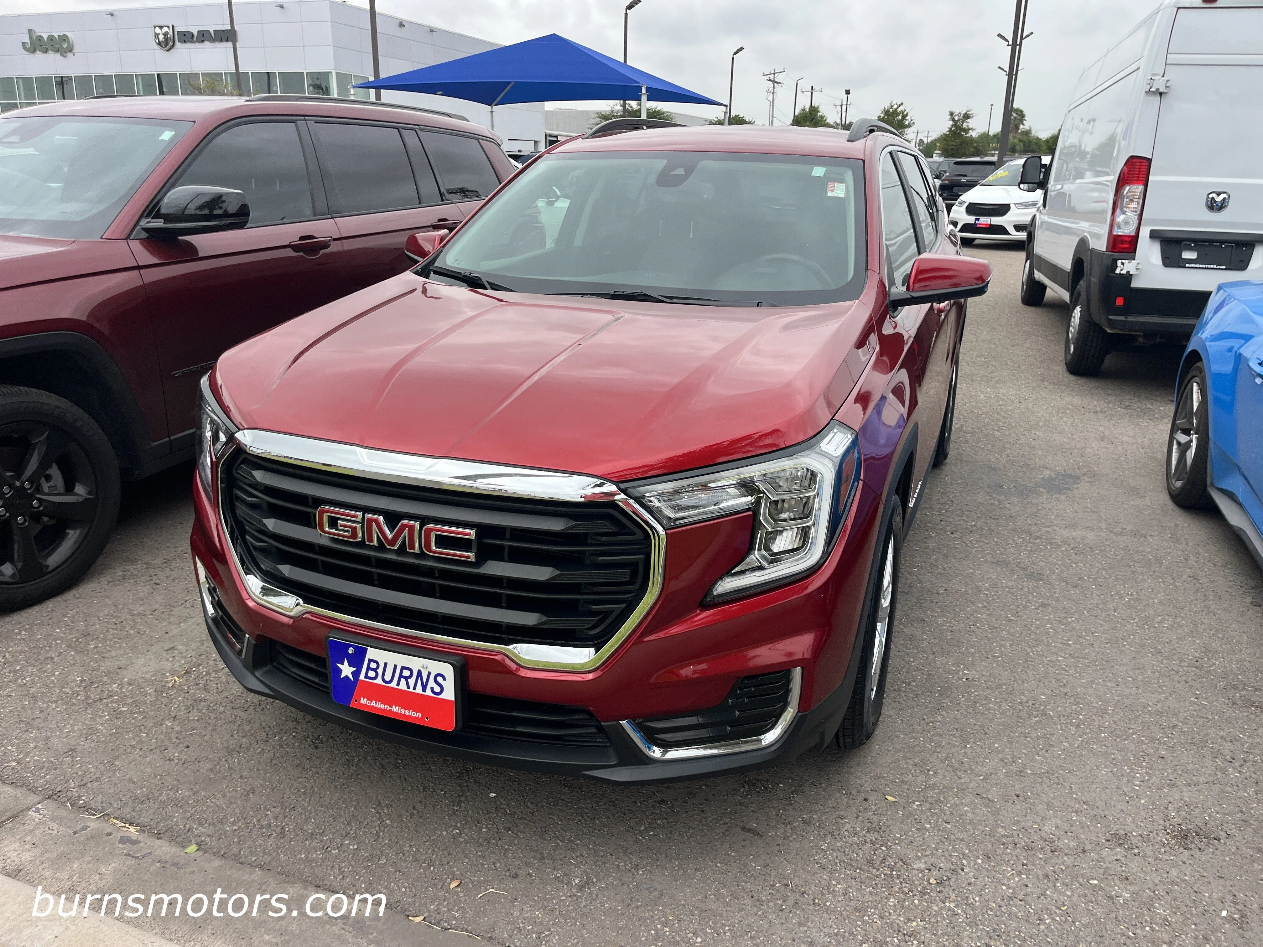 Used 2024 Volcanic Red Tint GMC SLE image 2