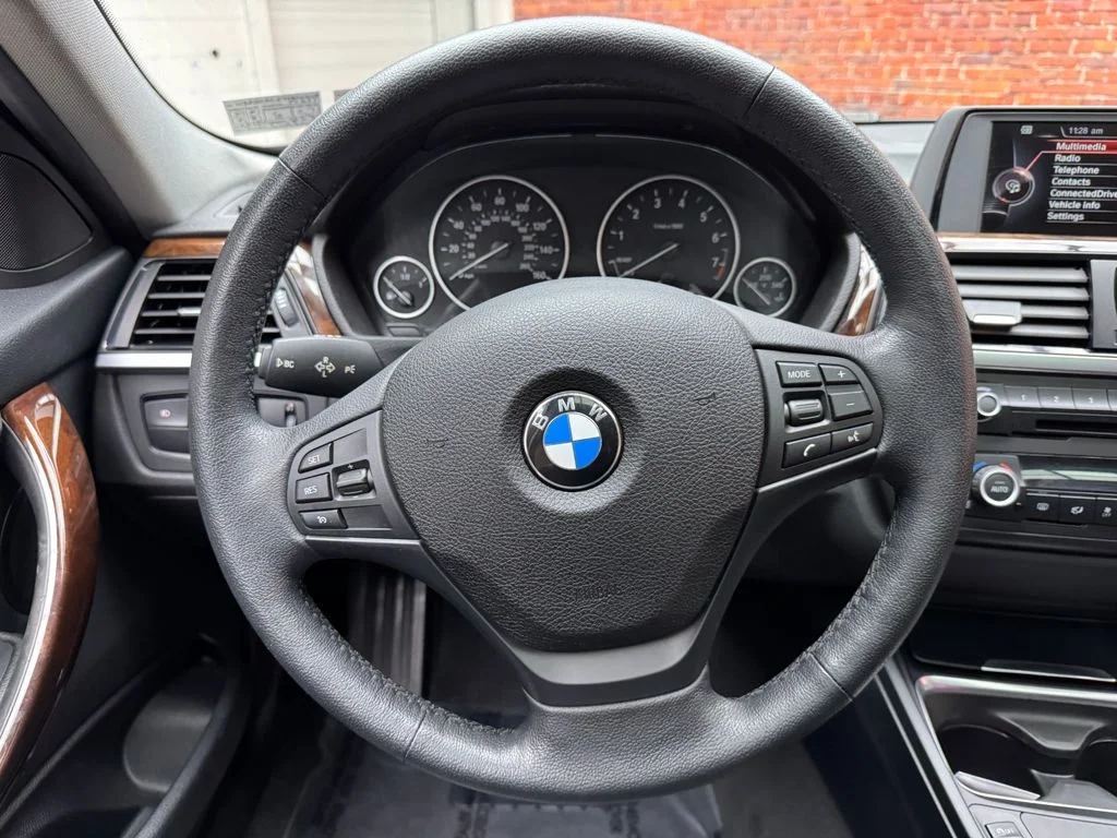 Used 2015 Black BMW 320i xDrive image 14