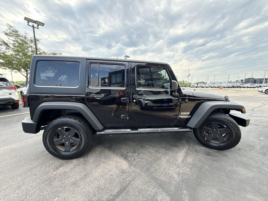 Used 2013 Black Jeep Unlimited Sport image 4