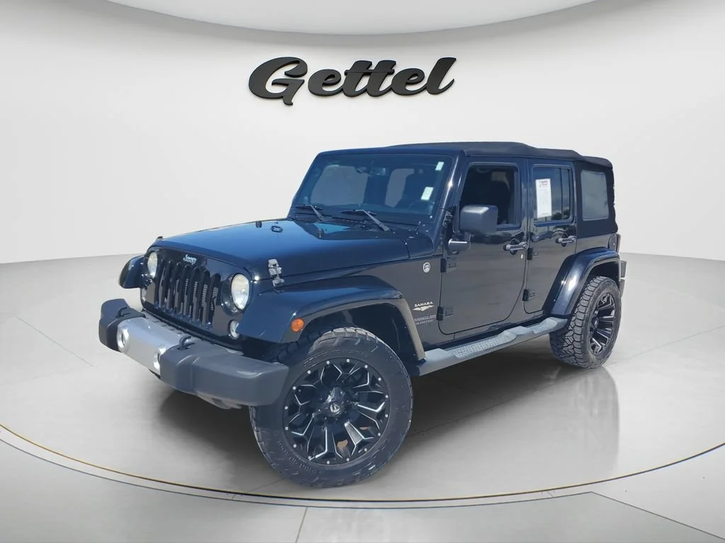 Used 2014 Black Jeep Sahara image 1