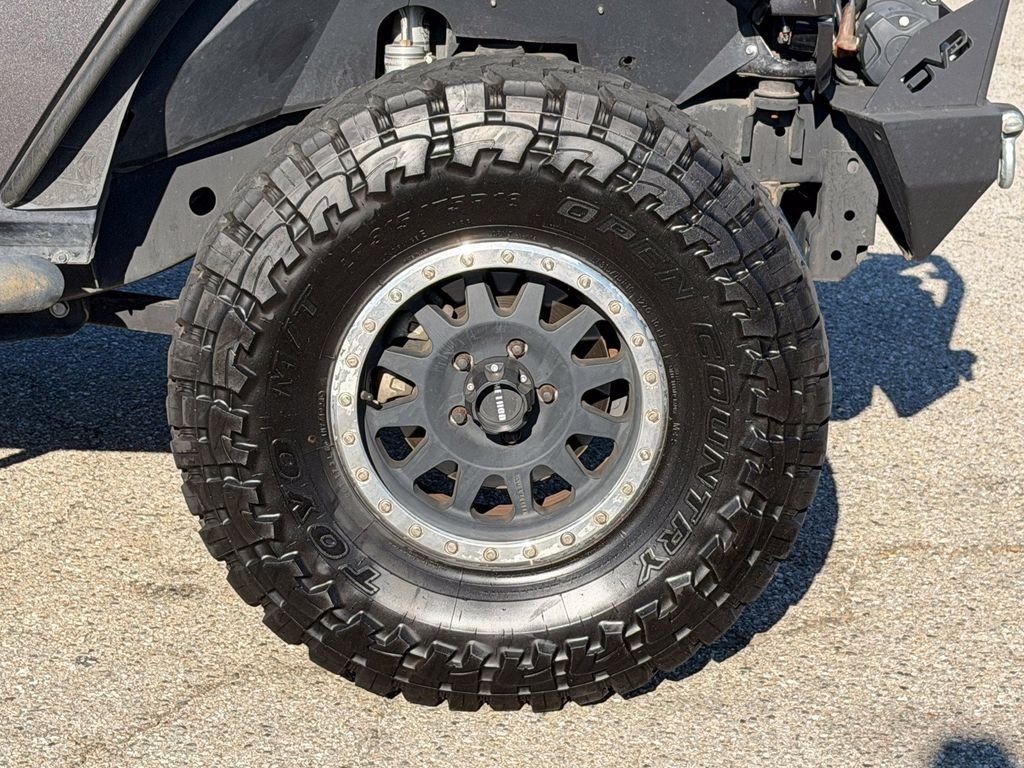 Used 2016 Granite Crystal Clearcoat Metallic Jeep Unlimited Sport image 7