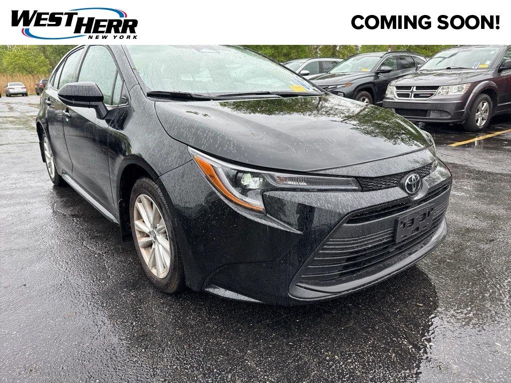 Used 2025 Midnight Black Metallic Toyota LE image 1
