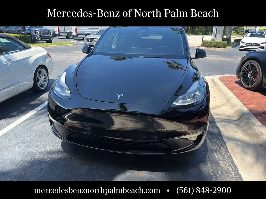 Used 2025 Tesla Model Y Long Range with VIN 7SAYGDED7SF253633 for sale in Palm Beach Gardens, FL