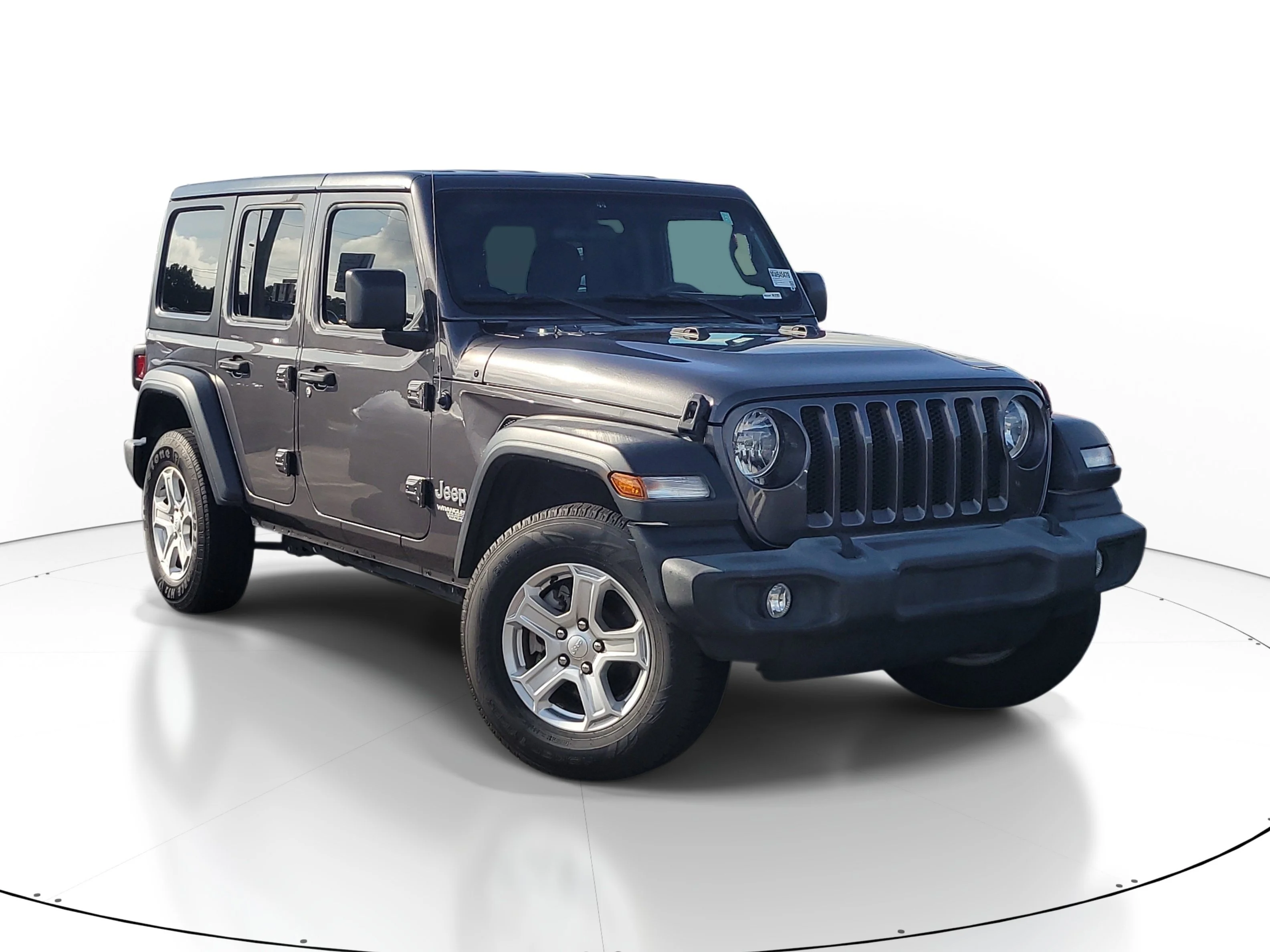 Used 2021 Granite Crystal Metallic Clearcoat Jeep Unlimited Sport S image 1