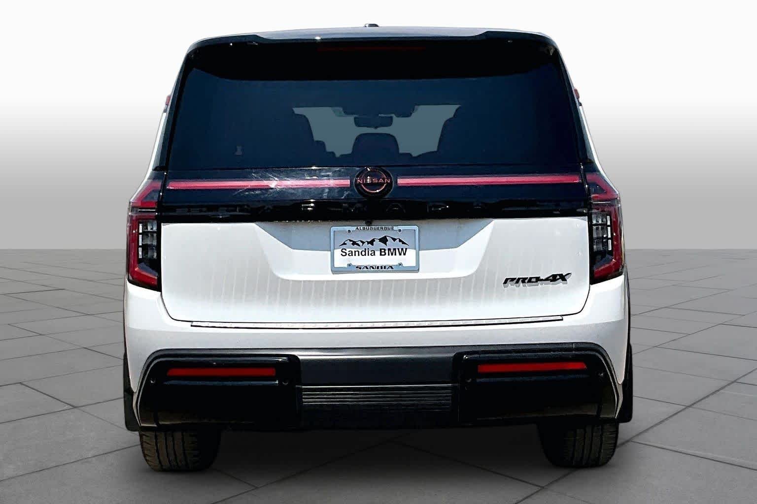 Used 2025 Aspen White Tricoat/Super Black Nissan PRO-4X image 4