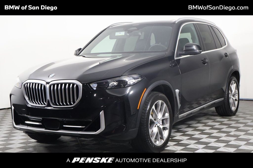 Certified Used 2024 Black Sapphire Metallic BMW sDrive40i image 1