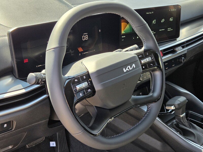 New 2026 Ivory Silver Kia LX image 10
