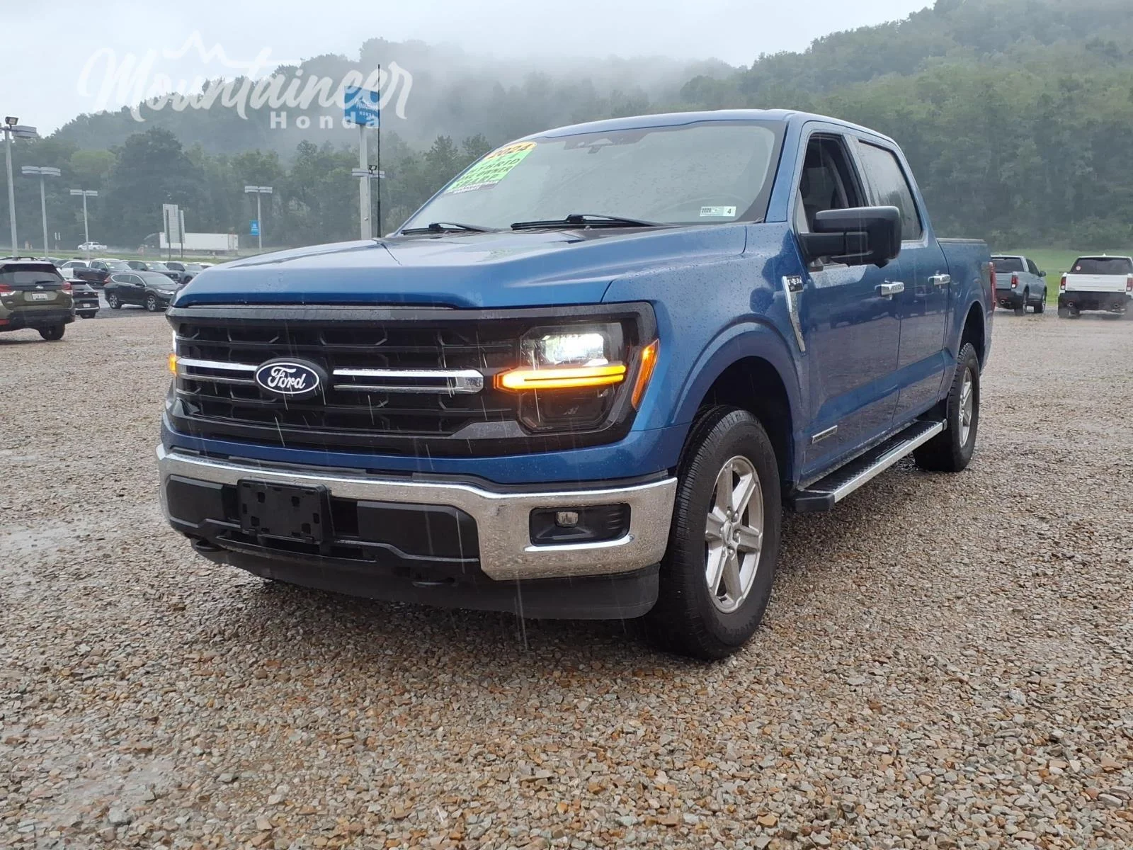 Used 2024 Atlas Blue Ford XLT image 1