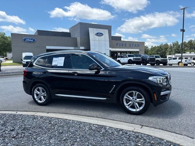 Used 2021 Black BMW sDrive30i image 1