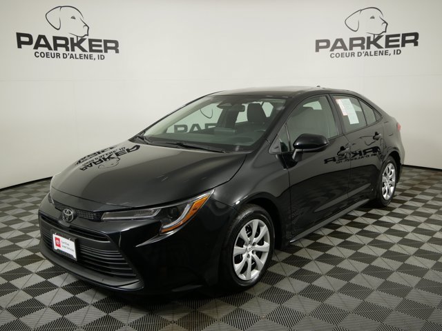 Used 2025 Midnight Black Metallic Toyota LE image 1
