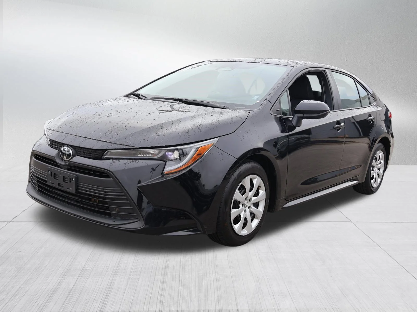 Used 2025 Midnight Black Metallic Toyota LE image 3