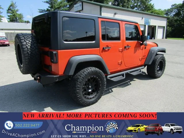 Used 2015 Orange Jeep Unlimited Sport image 5