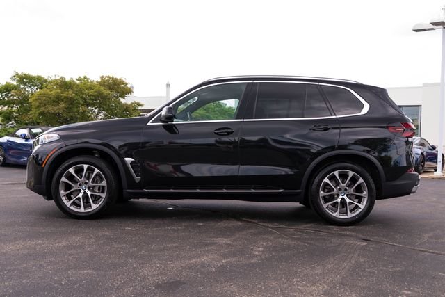 Certified Used 2025 Black Sapphire Metallic BMW xDrive40i image 2