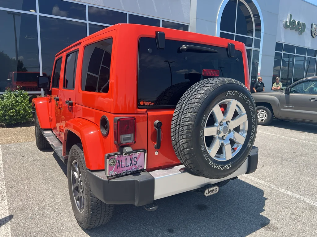 Used 2015 Sunset Orange Pearlcoat Jeep Sahara image 5