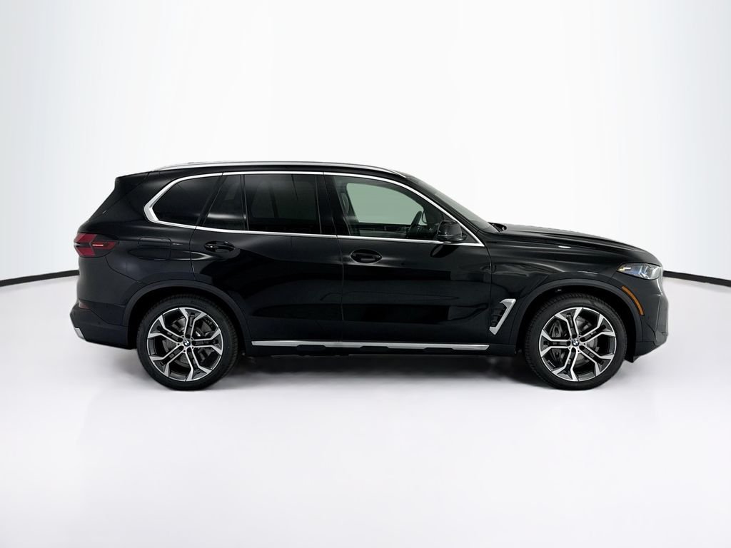 New 2026 Black Sapphire Metallic BMW xDrive50e image 4