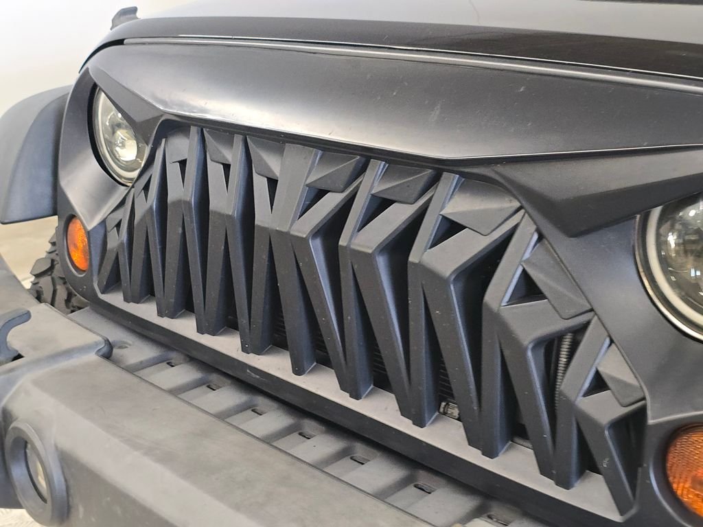 Used 2013 Black Jeep Unlimited Sport image 13