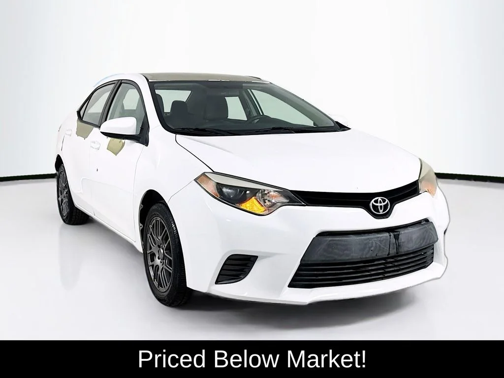 Used 2015 Super White Toyota LE image 1