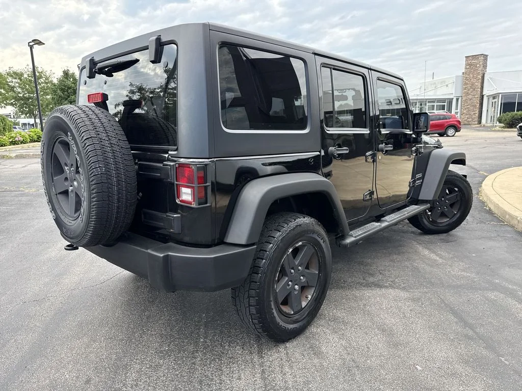 Used 2013 Black Jeep Unlimited Sport image 3