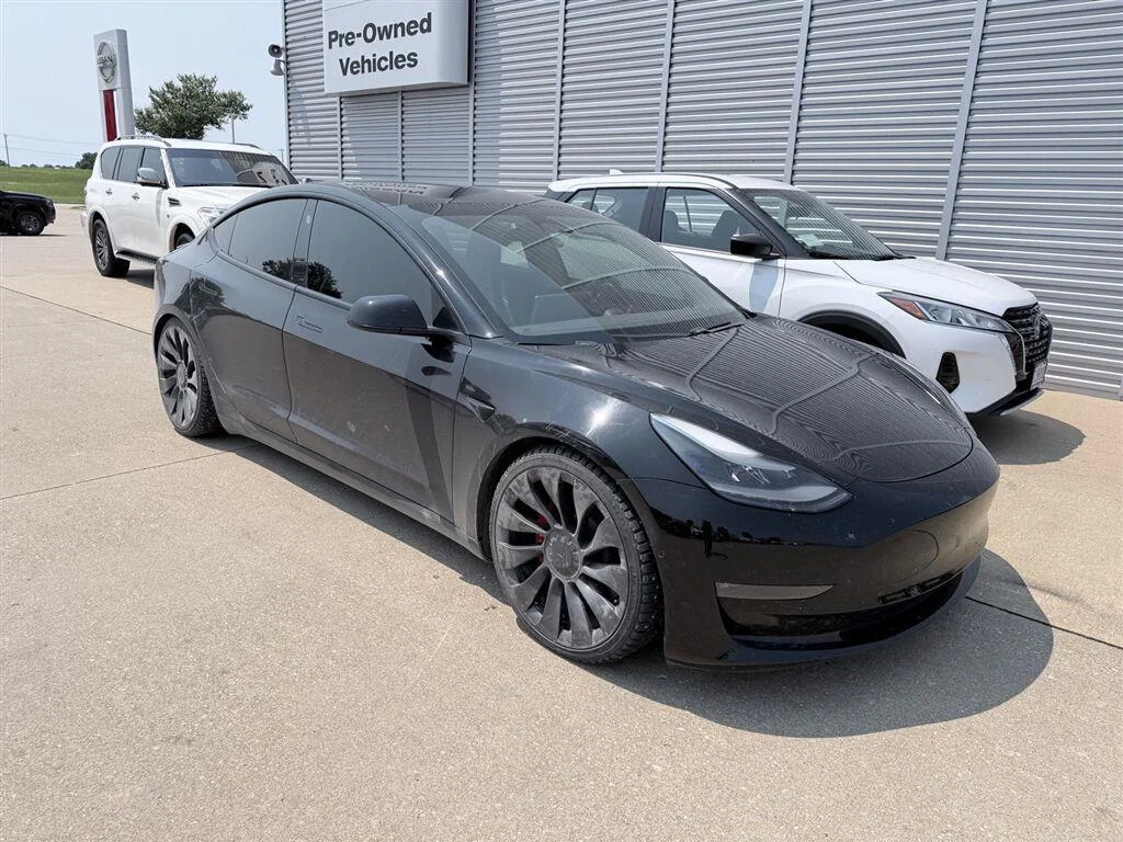 Used 2021 Solid Black Tesla Performance image 1