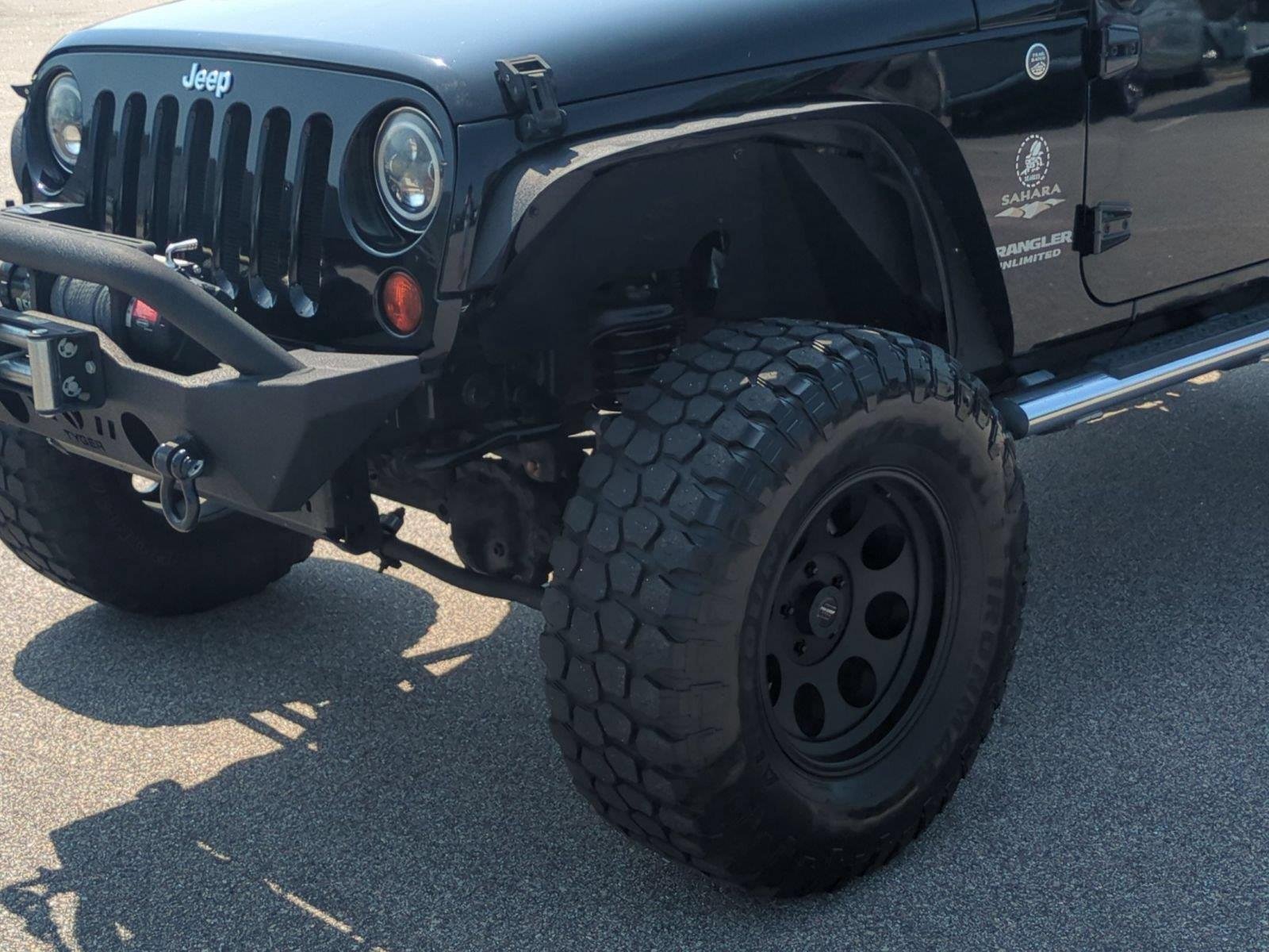 Used 2012 Black Clearcoat Jeep Sahara image 9