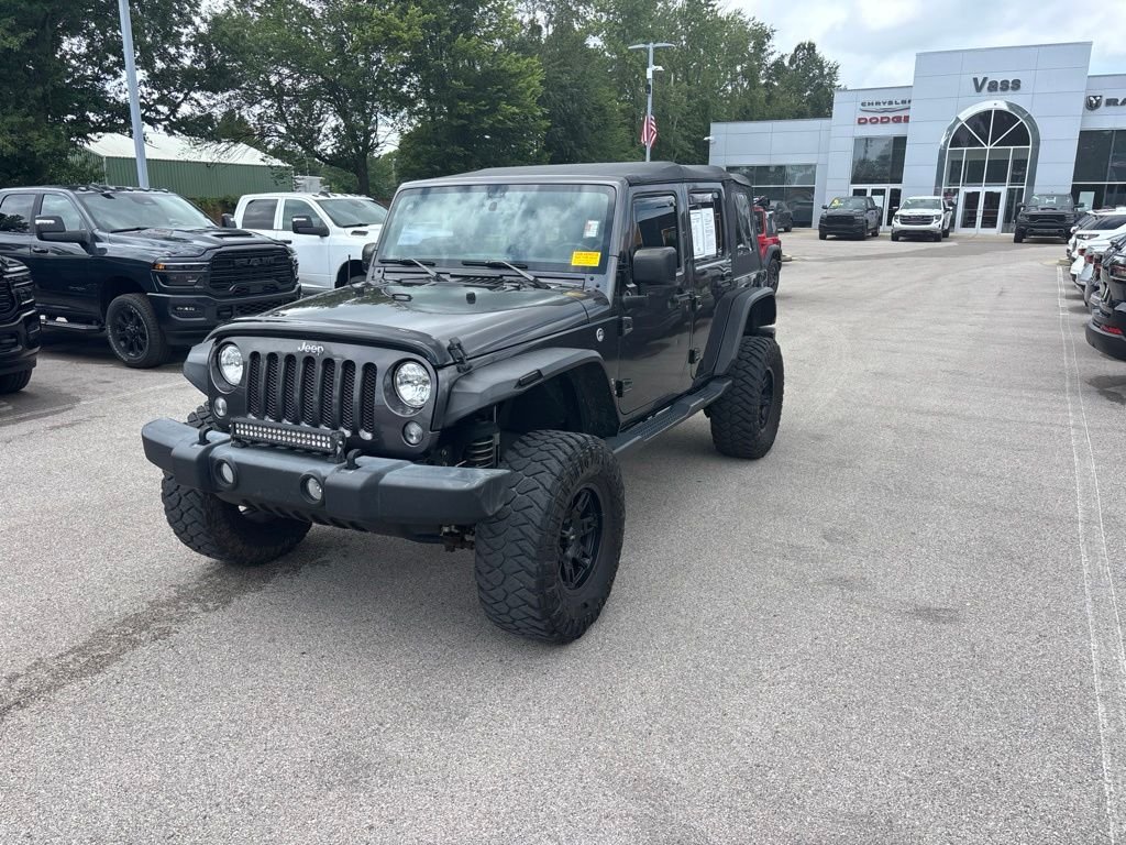 Used 2017 Gray Jeep Unlimited Sport image 1
