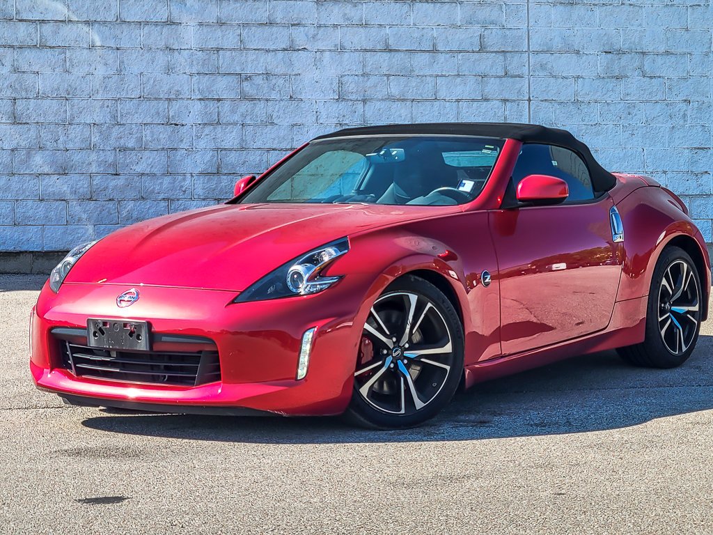 Used 2018 Passion Red Nissan Touring Sport image 2