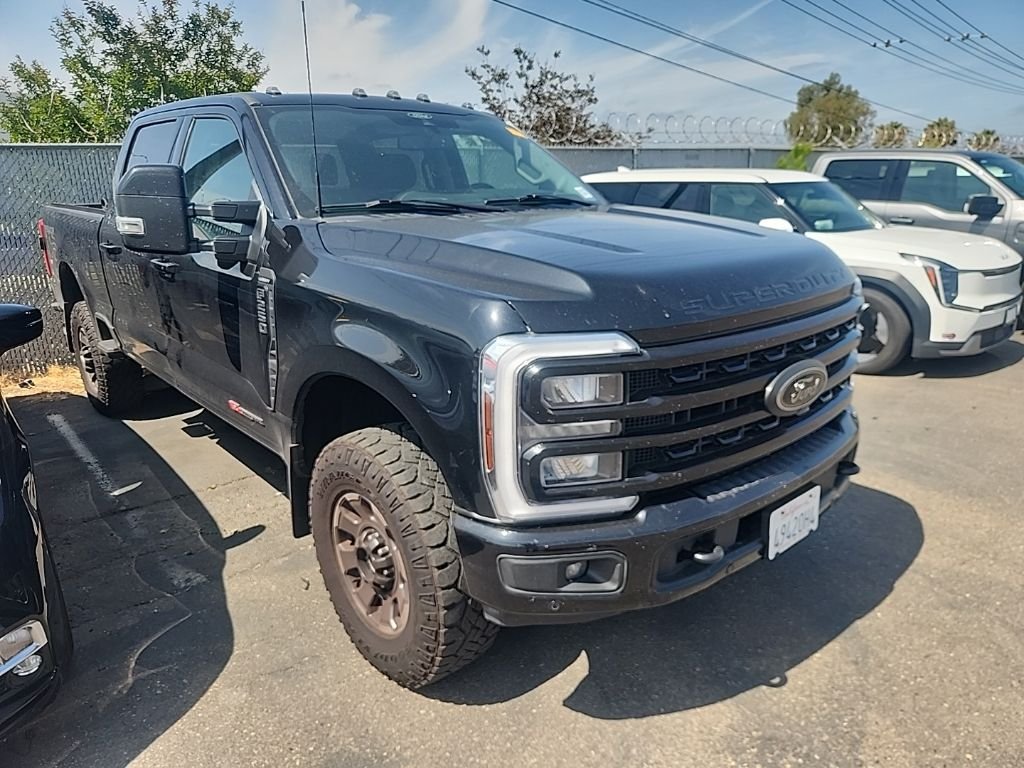Used 2024 Agate Black Metallic Ford Lariat image 1