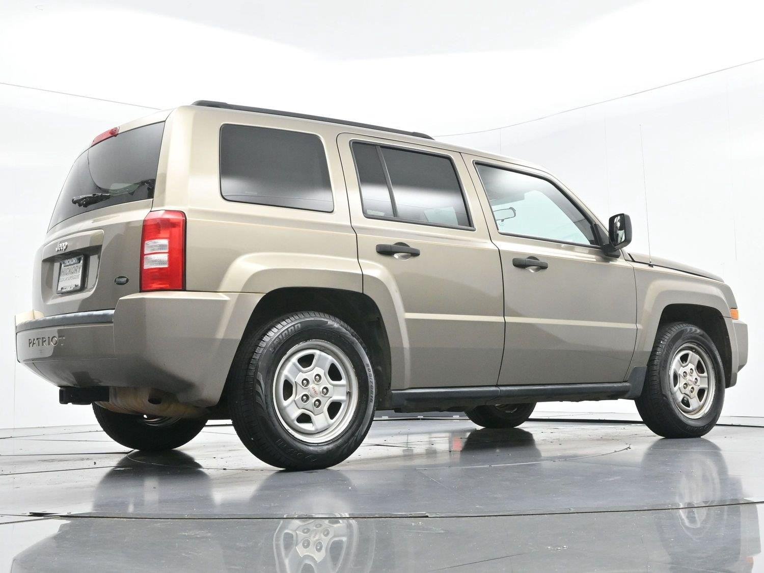 Used 2008 Light Khaki Metallic Jeep Sport image 44