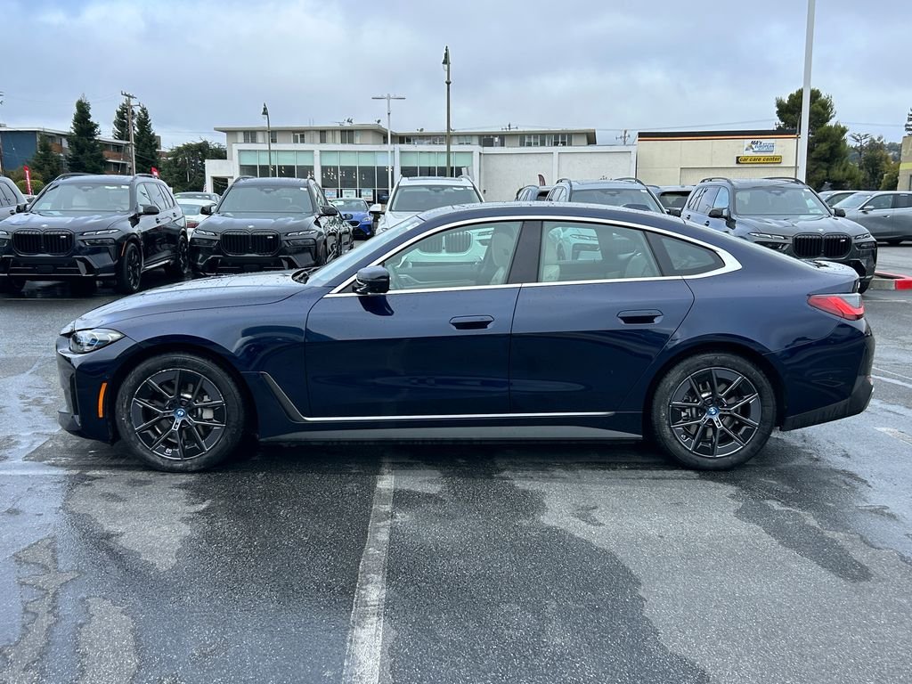 Certified Used 2023 Tanzanite Blue II Metallic BMW eDrive40 image 2