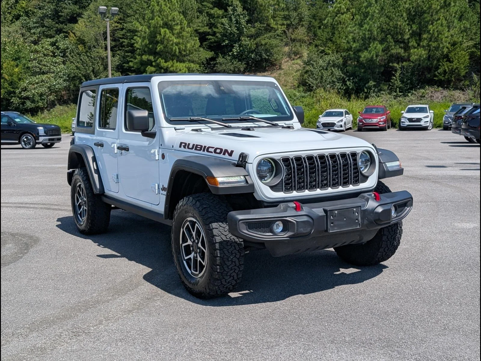 Used 2025 Bright White Clear Coat Jeep Rubicon image 1