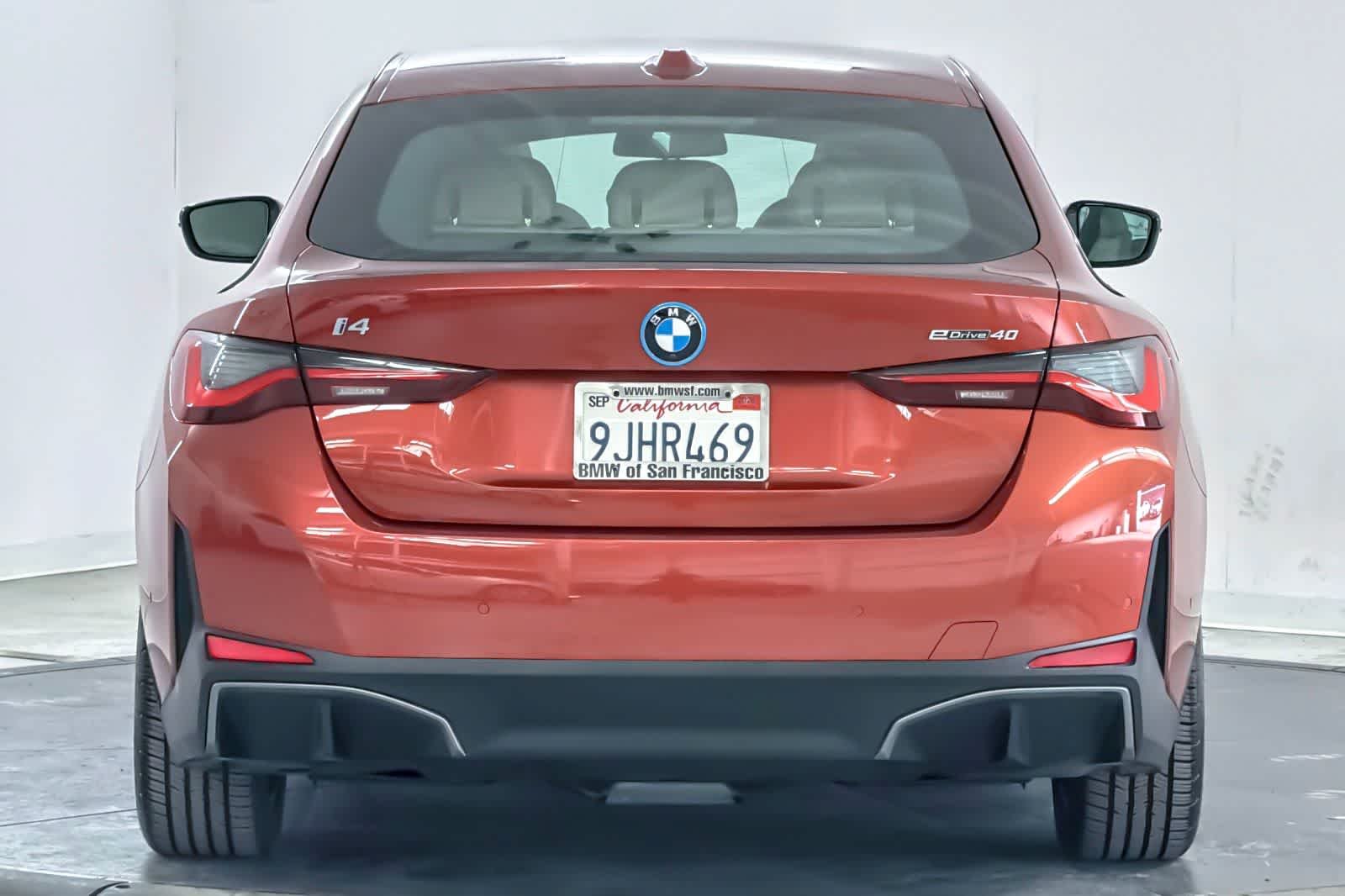 Used 2024 Sunset Orange Metallic BMW eDrive40 image 7