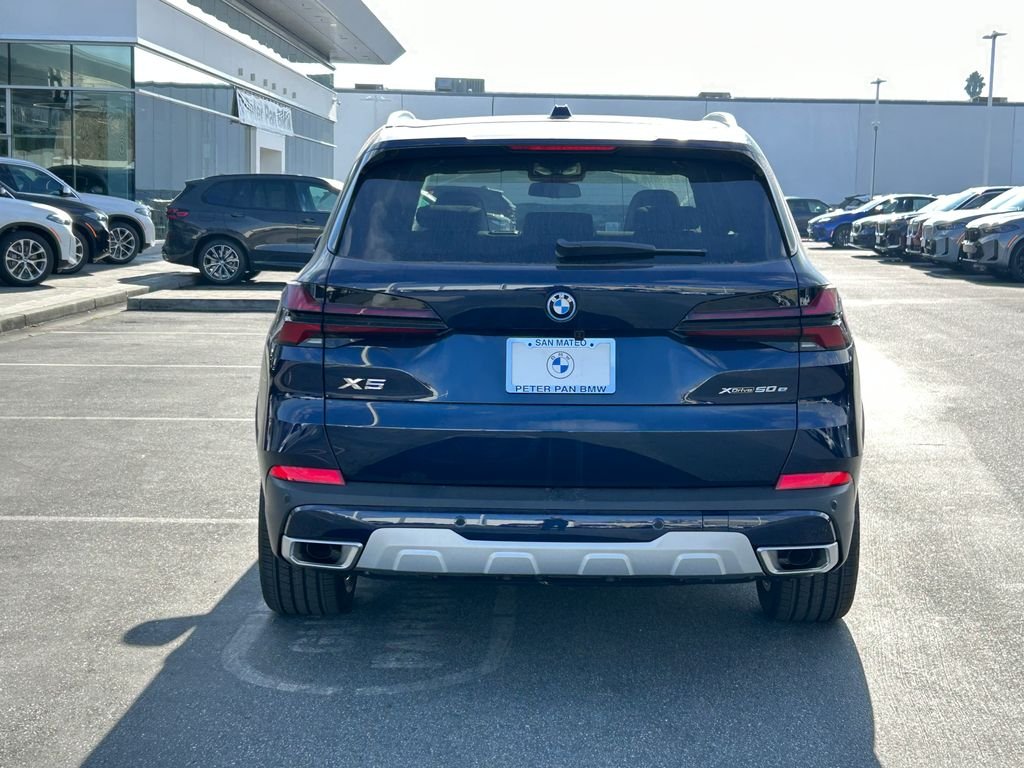 New 2026 Tanzanite Blue II Metallic BMW xDrive50e image 4