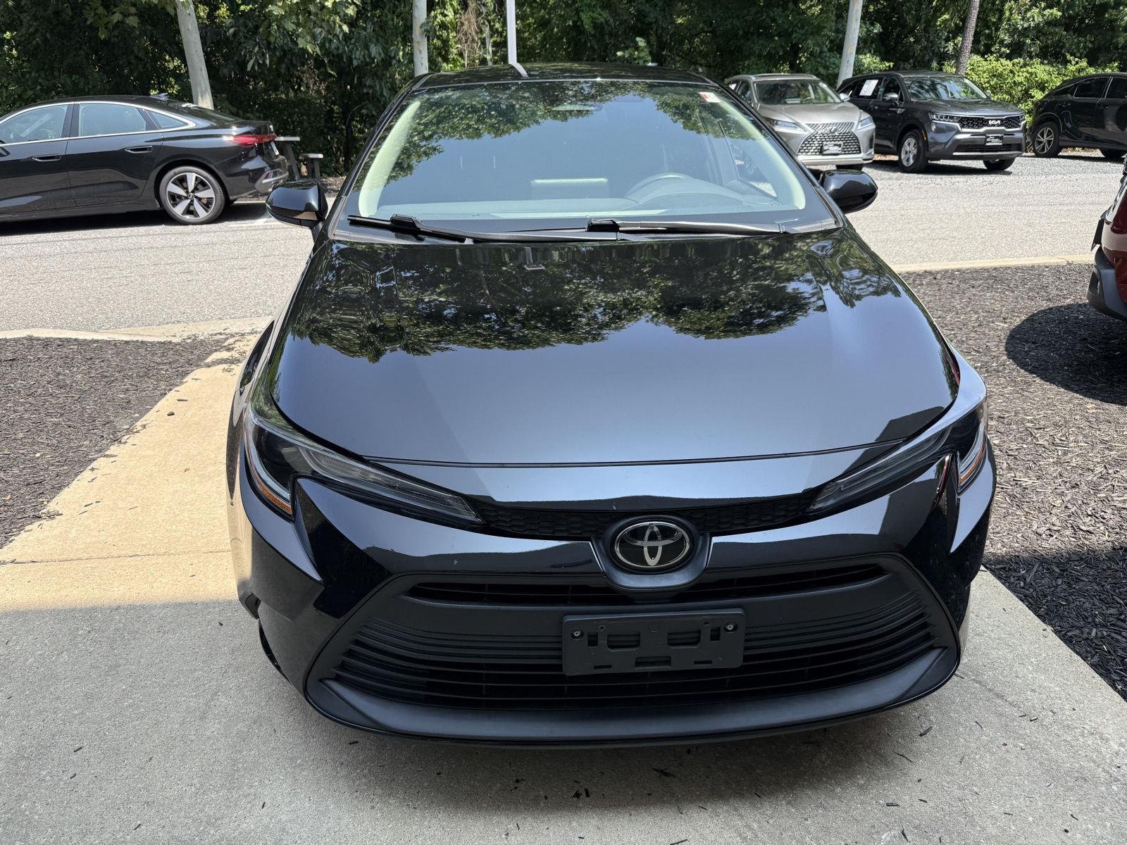 Used 2023 Midnight Black Metallic Toyota LE image 2