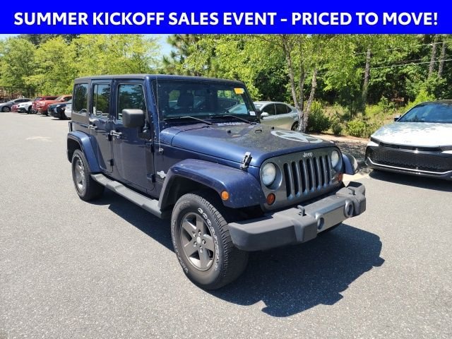 Used 2013 Blue Jeep Unlimited Sport image 1