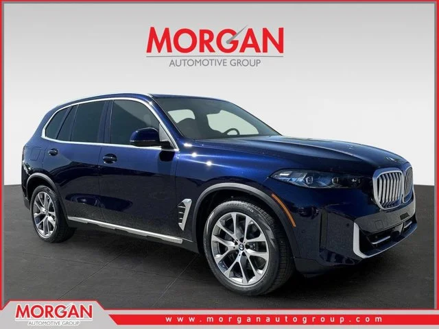 New 2026 Tanzanite Blue II Metallic BMW xDrive50e image 1