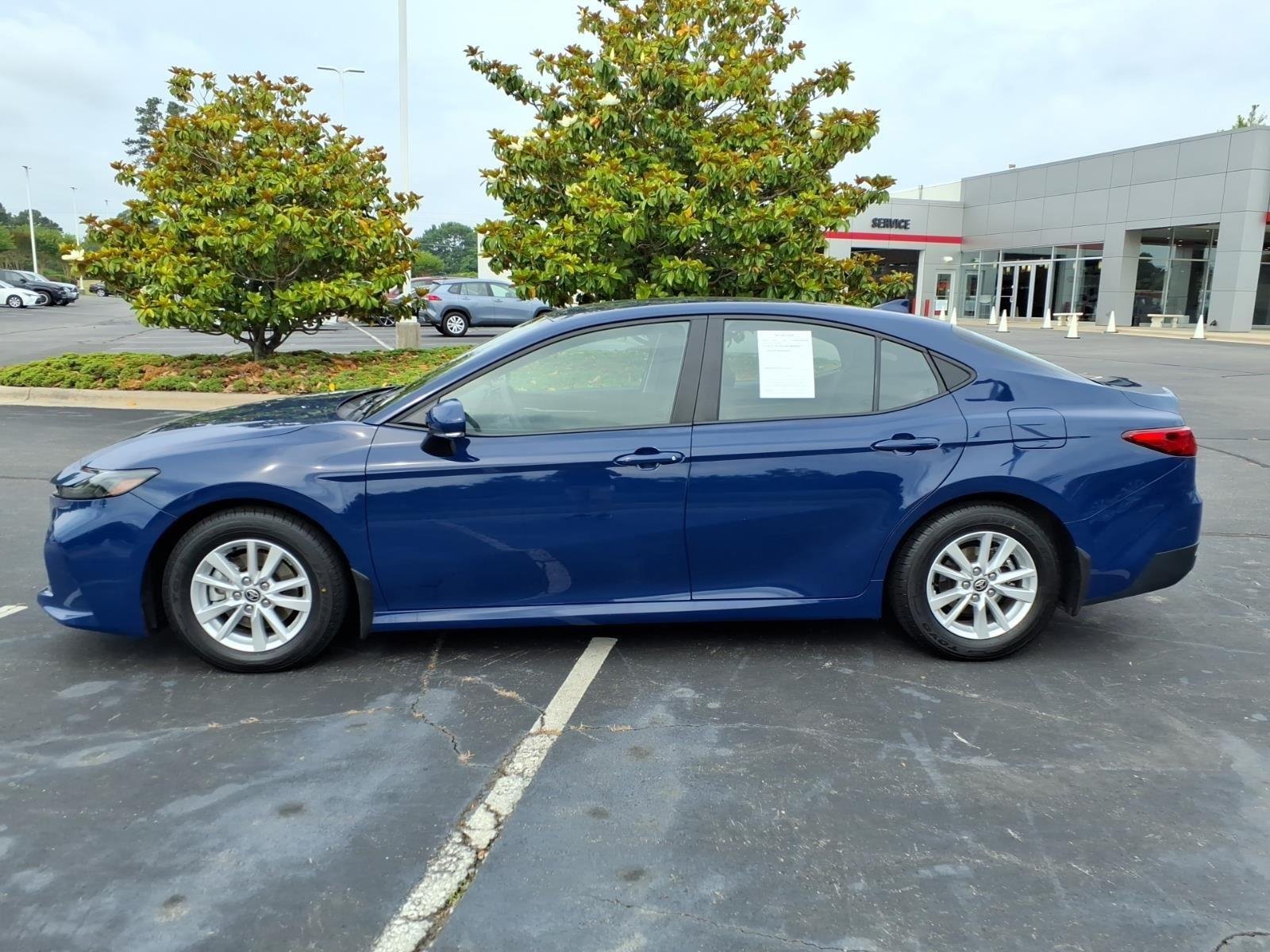 Used 2025 Reservoir Blue Toyota LE image 3