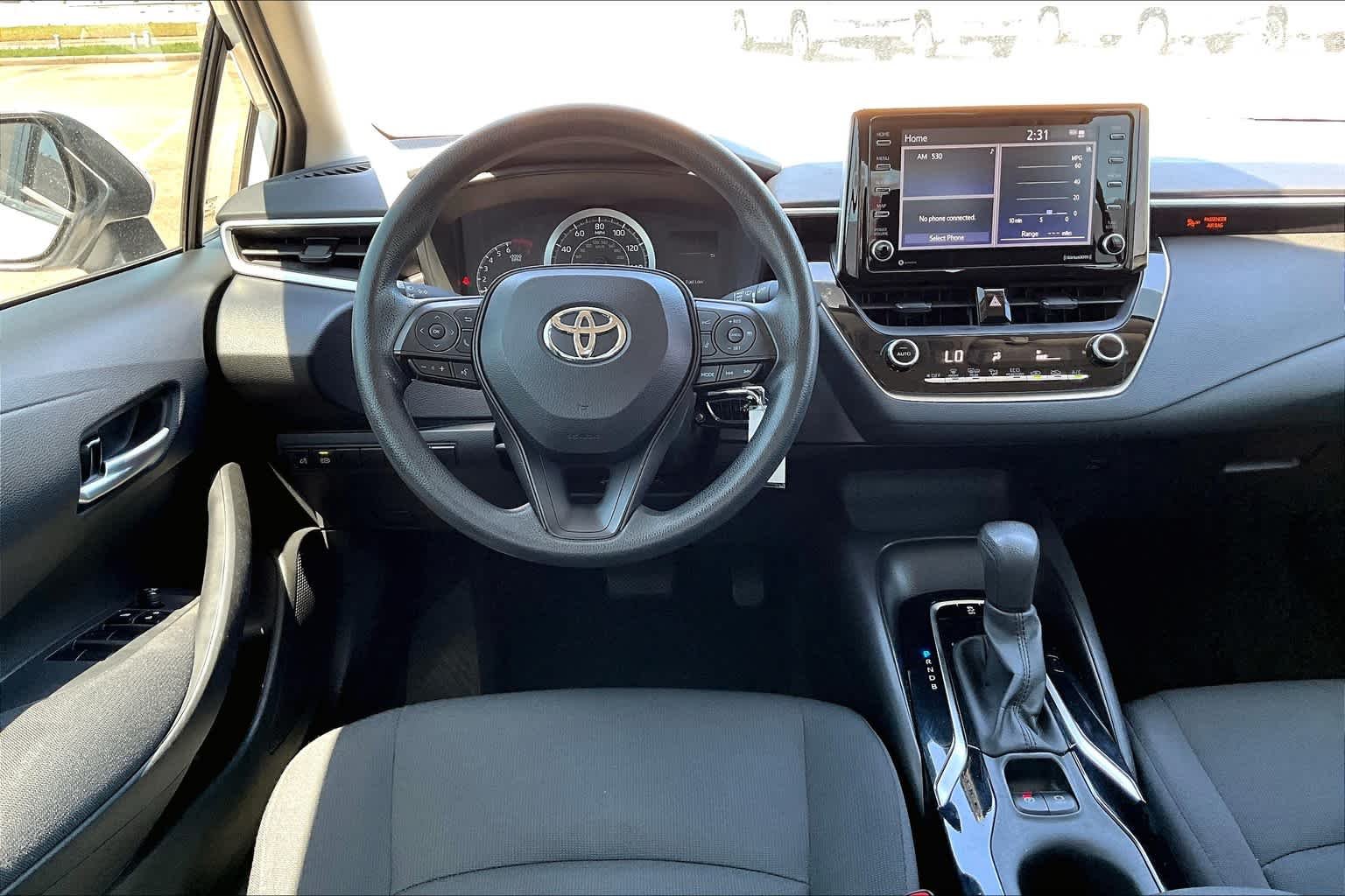 Used 2021 Super White Toyota LE image 6