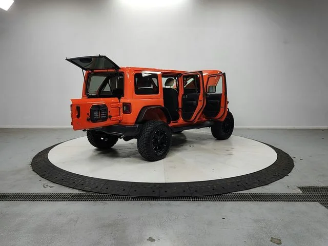 Used 2018 Orange Jeep Unlimited Sahara image 15