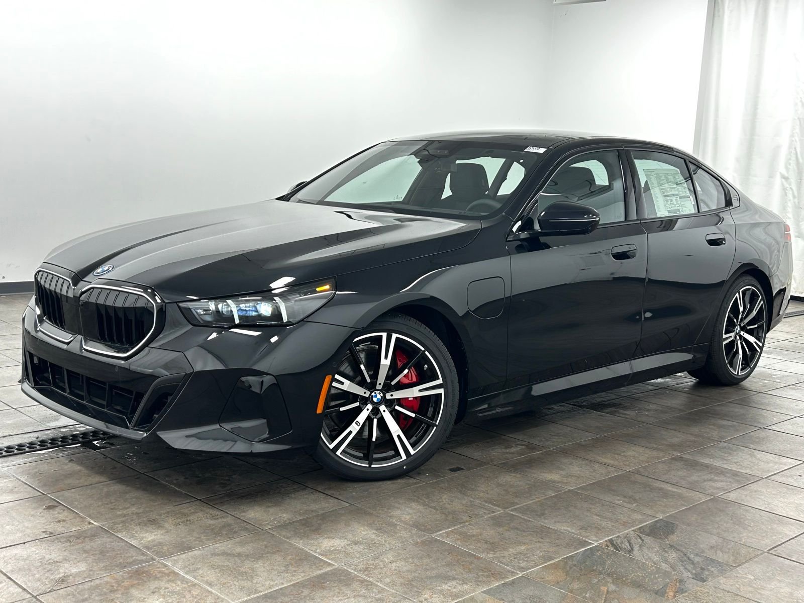 2026 BMW 5 Series 550e xDrive Sedan's photo