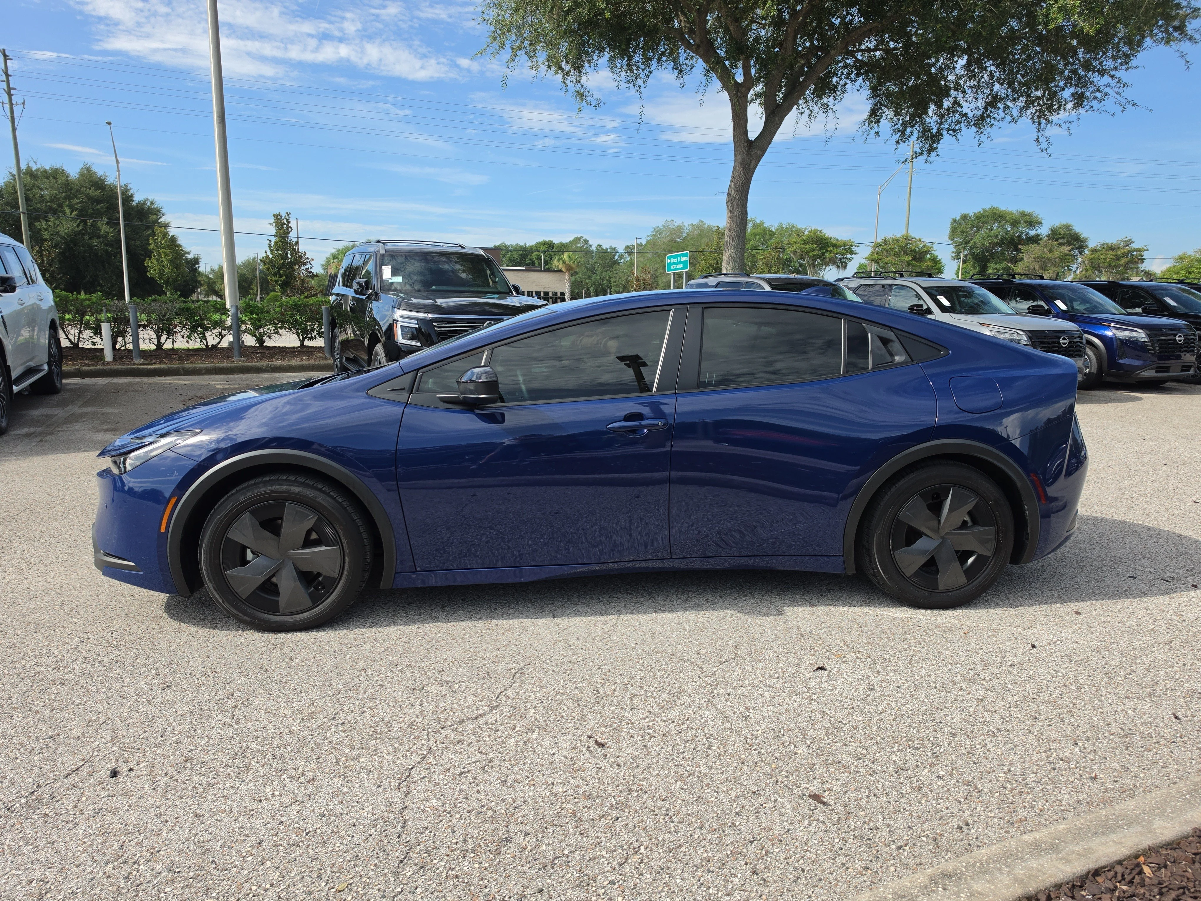 Used 2024 Reservoir Blue Toyota LE image 5