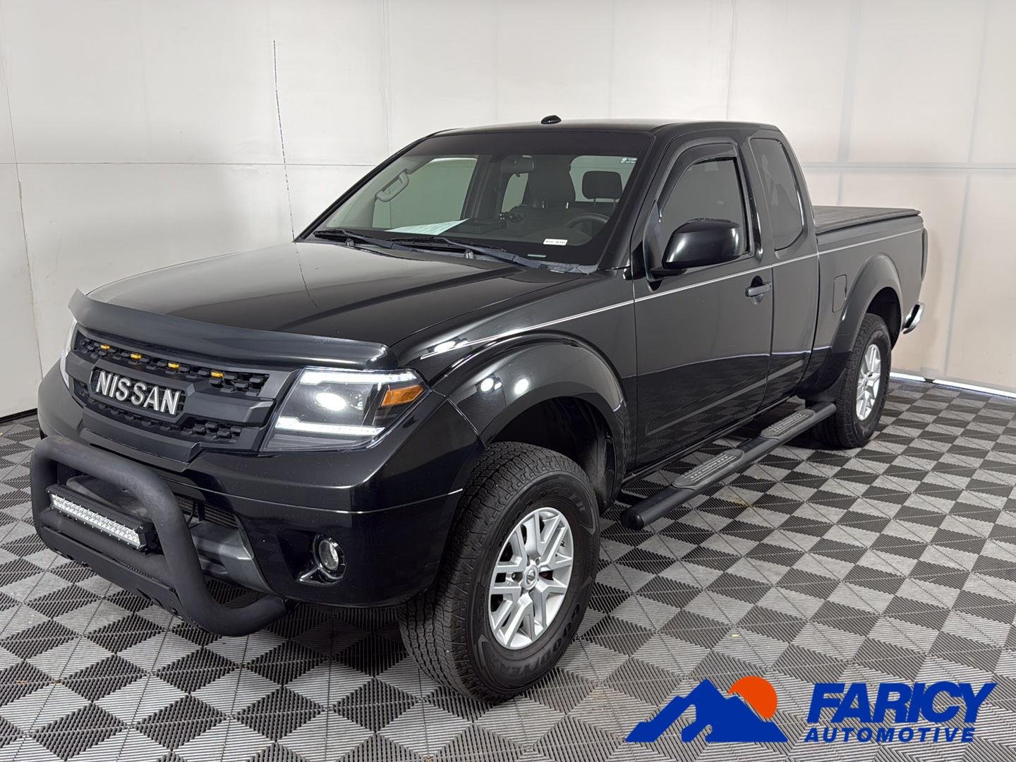 Used 2014 Super Black Nissan SV image 1