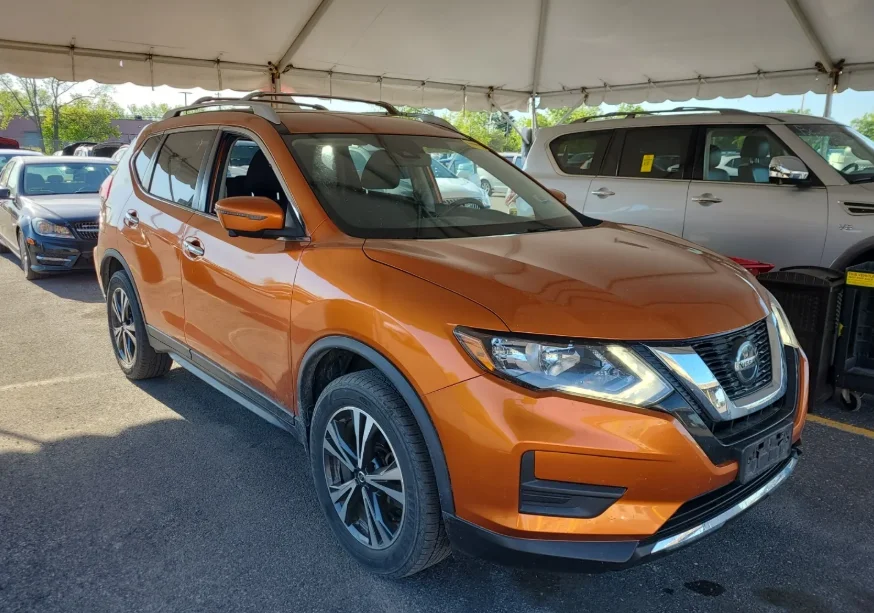 Used 2019 Orange Nissan SV image 1